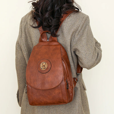 Backpack with Round Medal Emblem On Front Flap