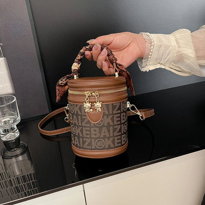 Bucket Bag With Monogram Pattern And Leather Trim Charm