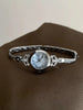 Oval Dial Quartz Watch with Bracelet Style Accessory - Sixteen