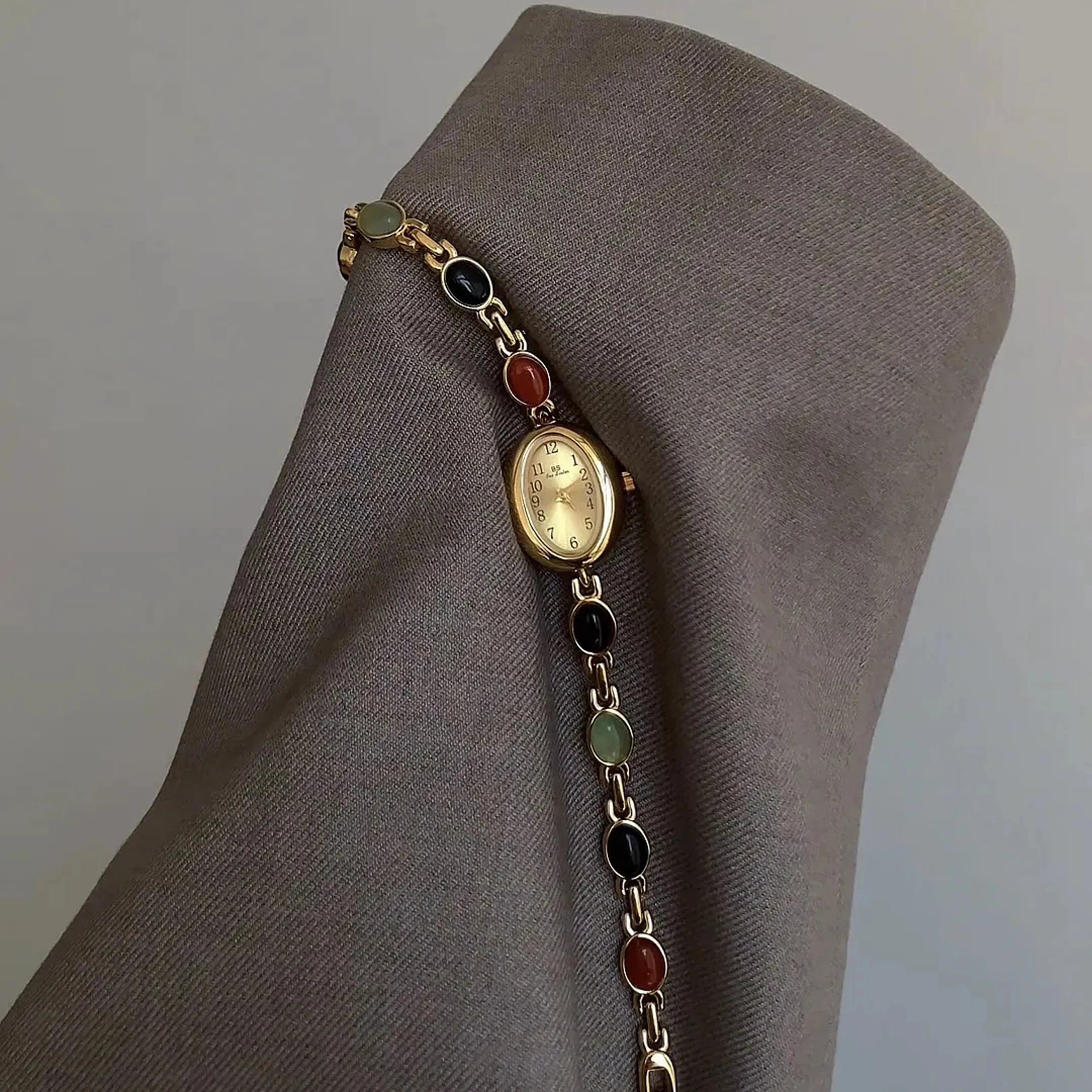 Elegant Oval Face Watch with Gemstone Bracelet
