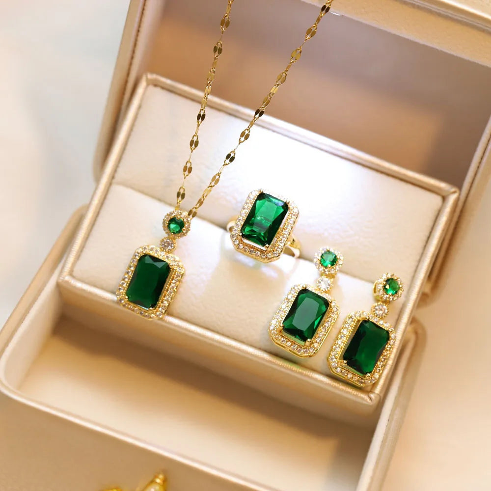 Gold and emerald jewelry set in a gold box