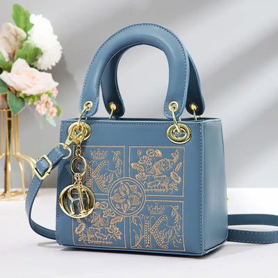 Embroidered Satchel With Gold Hardware Charm Detail