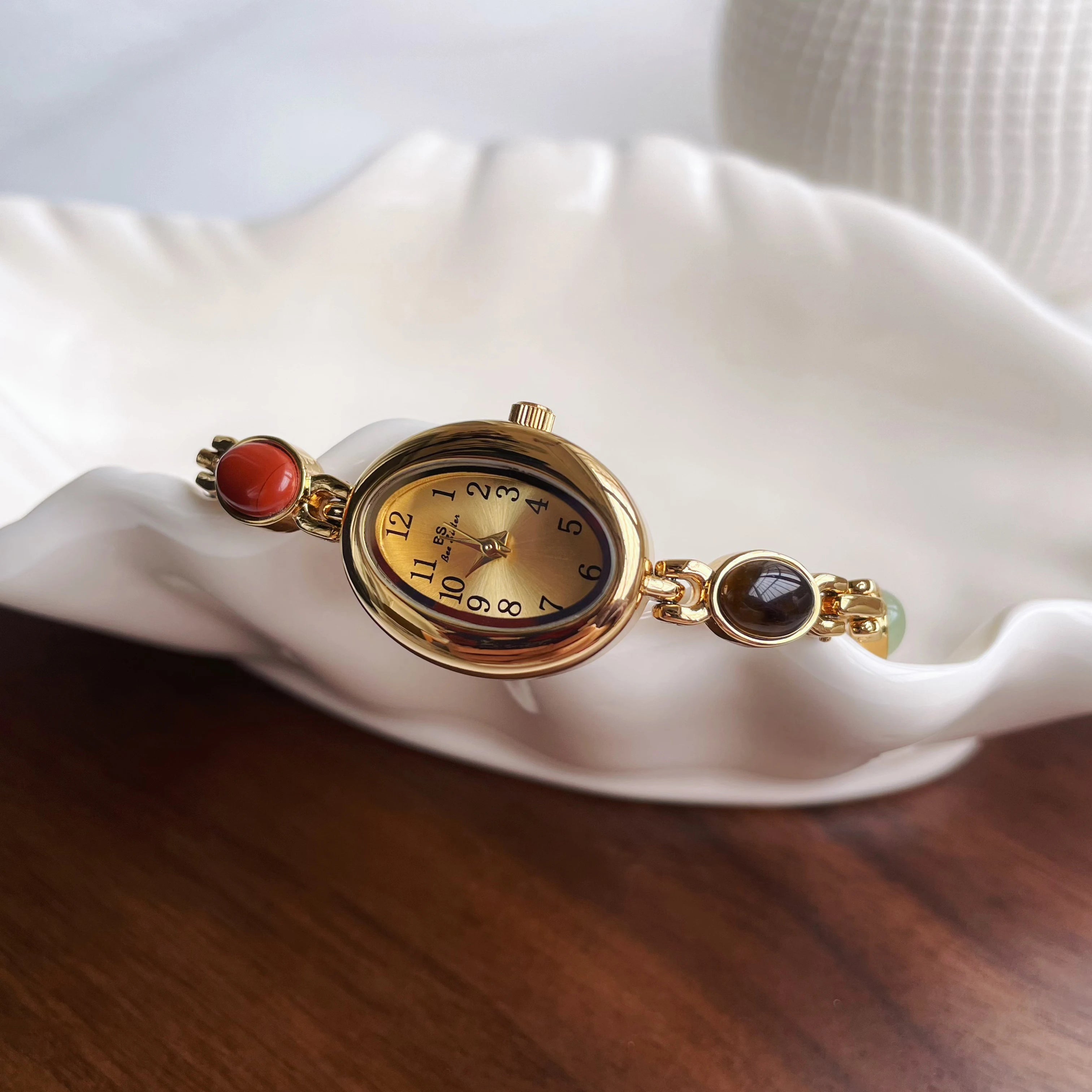 Elegant Oval Face Watch with Gemstone Bracelet