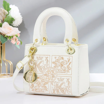 Embroidered Satchel With Gold Hardware Charm Detail