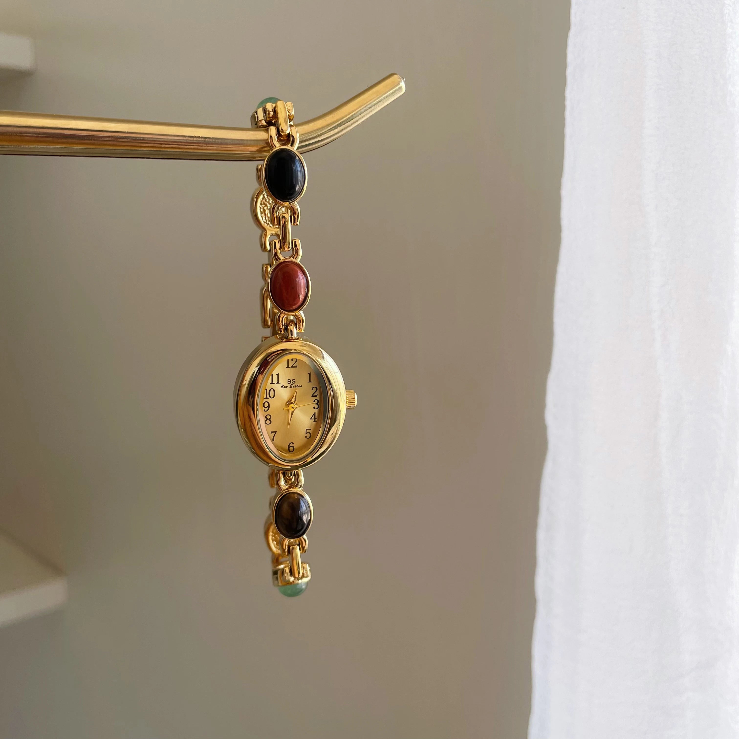 Elegant Oval Face Watch with Gemstone Bracelet