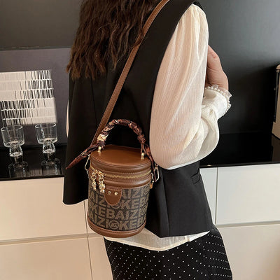 Bucket Bag With Monogram Pattern And Leather Trim Charm