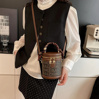 Bucket Bag With Monogram Pattern And Leather Trim Charm