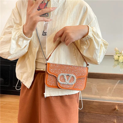 Parisian Bejeweled Crossbody Bag with Emblem Clasp